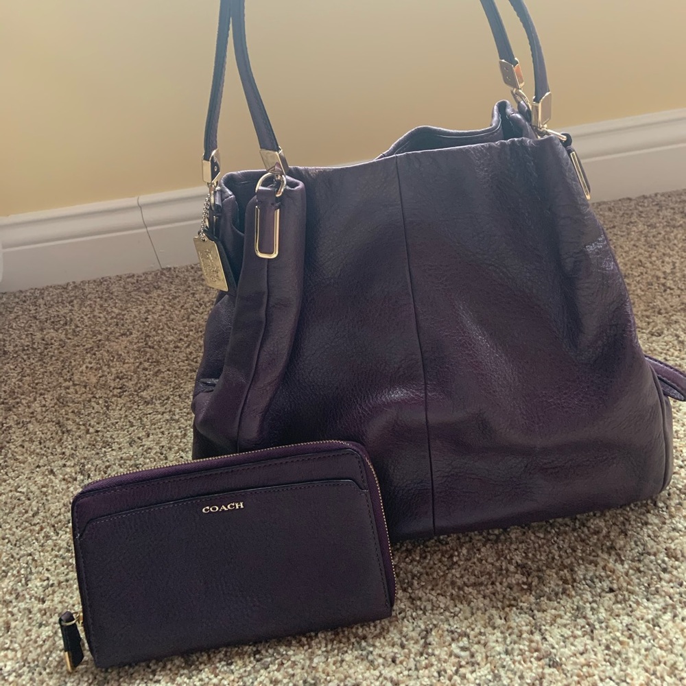 Eggplant colored Coach purse and matching wallet.